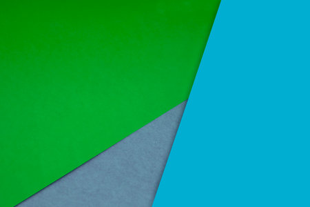 green and blue color paper background with copy space for text or imageの写真素材