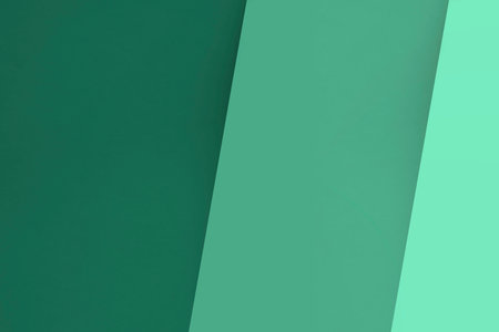 Colored paper background in green tones. Copy space for text.の写真素材