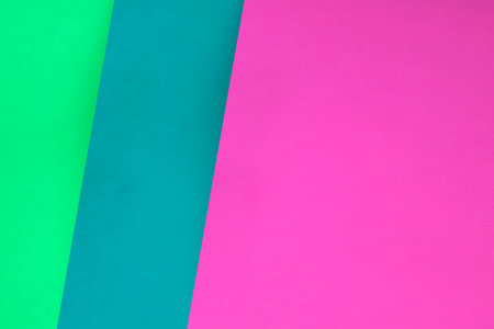 Colored paper background, pink and green tone. Copy space.の写真素材