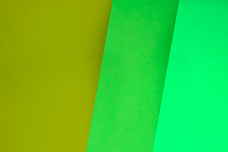 Green and yellow paper background. Abstract background with colorful paper sheets.の写真素材