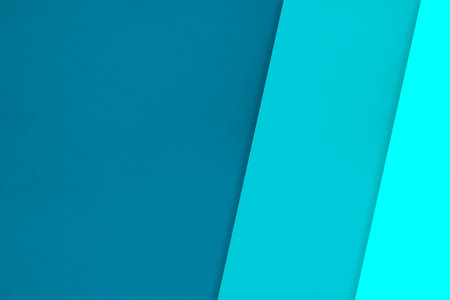 Blue and cyan color paper background. Minimal geometric abstract design.の写真素材
