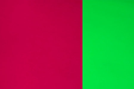 Green and pink paper background with copy space for text or image.の写真素材
