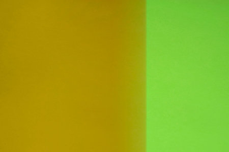 Green and yellow paper background with copy space for text or image.