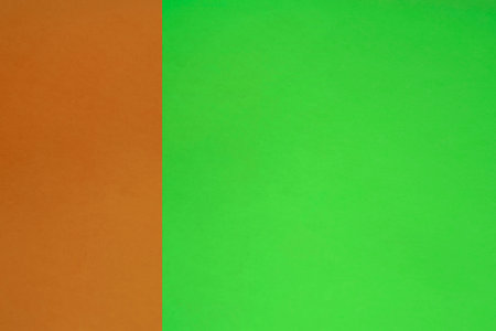 Green and orange paper background with copy space for text or image.