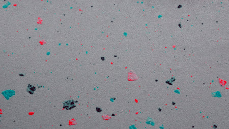 Colorful confetti on grey background. Texture for your design.