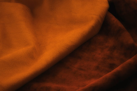 Close-up of orange satin fabric, can be used as backgroundの写真素材