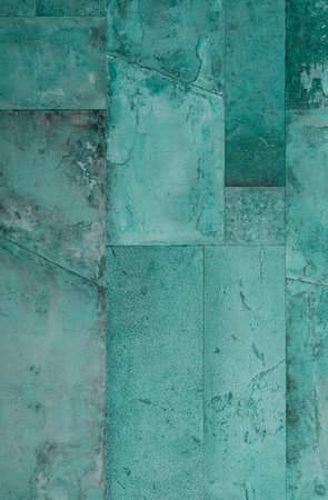 Background texture of concrete wall with green peeling paint, Thailand.