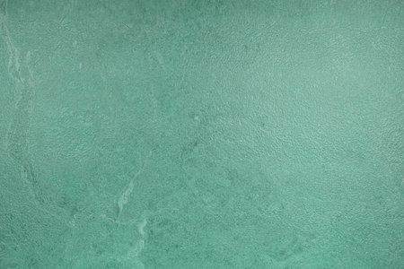 Texture of green decorative plaster or concrete. Abstract background for design.