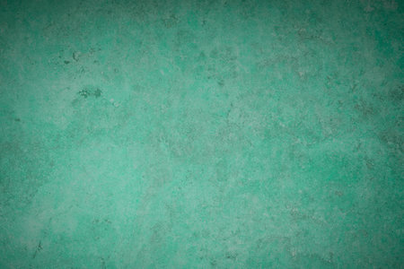 Green grunge wall texture or background for design with copy space.