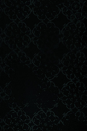 Black background with a pattern of ornaments. Wallpaper, texture