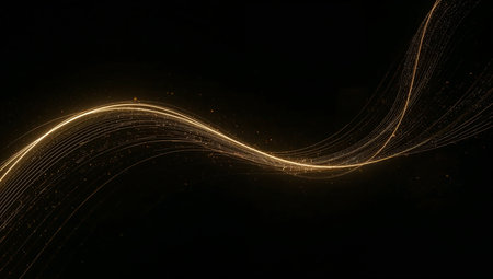 Abstract gold lines on a black background. Glowing lines in the dark.の素材