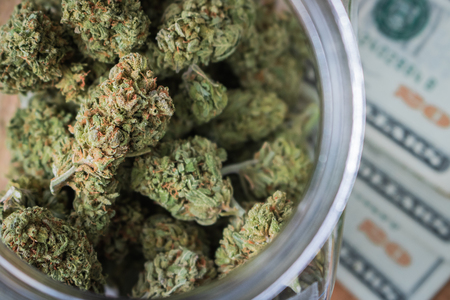 Marijuana In Jar On Money U.S. Currencyの写真素材