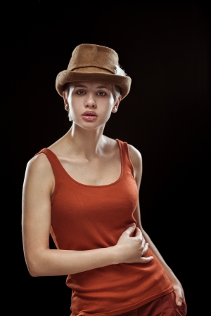 A young cute woman on a dark backgroundの写真素材