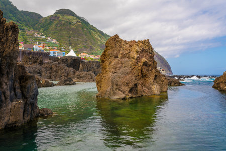 Natural pools with black volcanic rock in the Atlantic Ocean Porto Moniz, Madeira, Portugalの写真素材