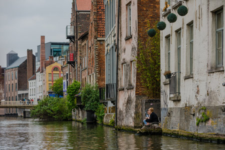 Belgium, Ghent city, old town, historical houses at River Leie at duskの写真素材
