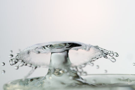 Water Drop with Ripples on water surfaceの写真素材