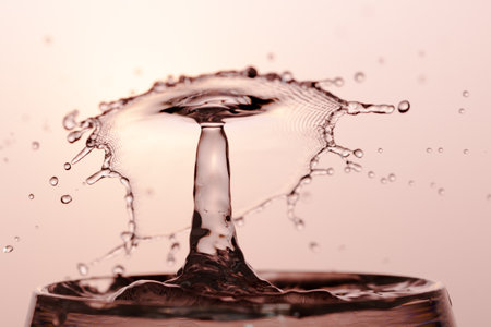 Water Drop with Ripples on water surfaceの写真素材