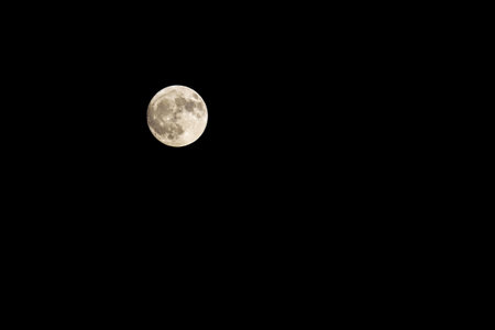 Glowing super full Moon in to the dark skyの写真素材