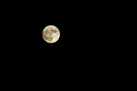 Glowing super full Moon in to the dark skyの写真素材