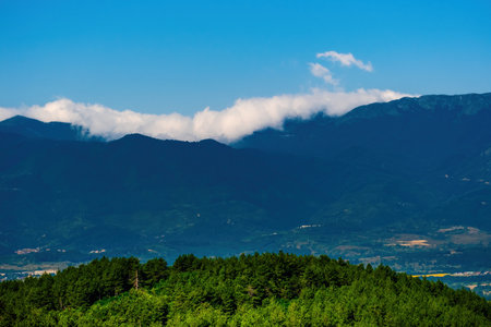 Beautiful mountains peaks view with clouds with clouds in skyの写真素材