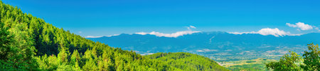 Beautiful mountains peaks view with clouds with clouds in skyの写真素材