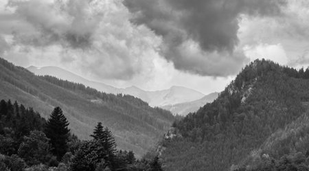 Alps mountains in stormy clouds, in black and whiteの写真素材