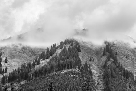 Alps mountains in stormy clouds, in black and whiteの写真素材