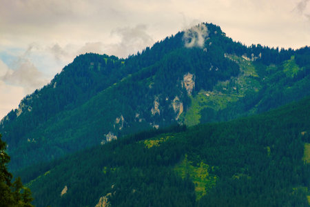 top of mountain hills in clouds, foggy, nature, landscapeの写真素材
