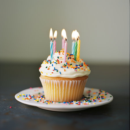 Birthday cupcake with candles, family celebrationsの写真素材
