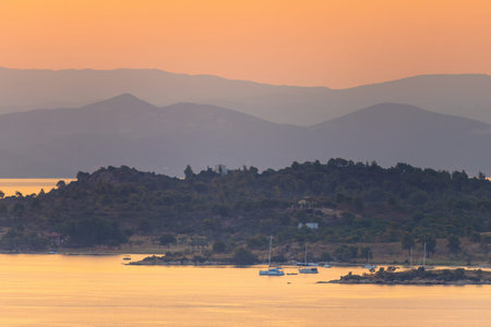 Mediterranean Sunset in Greece with mountainsの写真素材