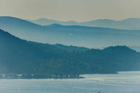 Mediterranean Sunset in Greece with mountainsの写真素材
