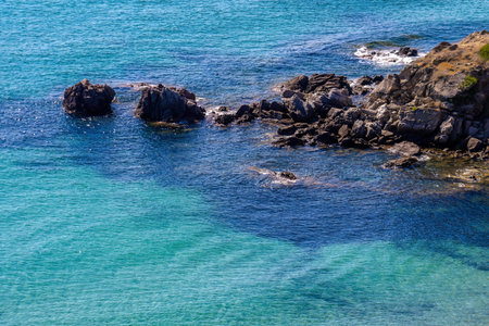 turquoise sea water with rocks on coast, Greece