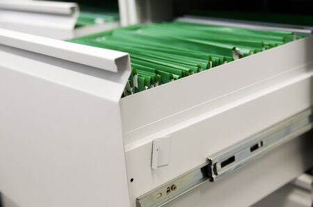 open grey case with green files archive close-upの写真素材