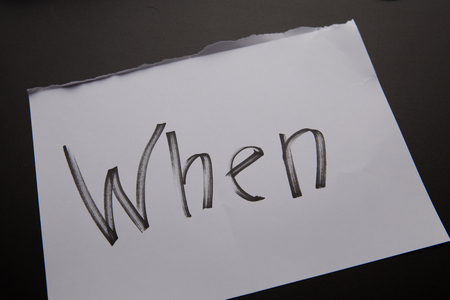 handwritten text When as Question. written on white paper with black marker. Concept meaning Asking for specific answersの写真素材