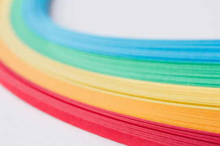 Craft supplies - tapes, paper rainbow colors, isolated on white close-upの写真素材