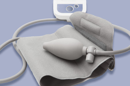 Medical tonometer for measuring blood pressure on purple background