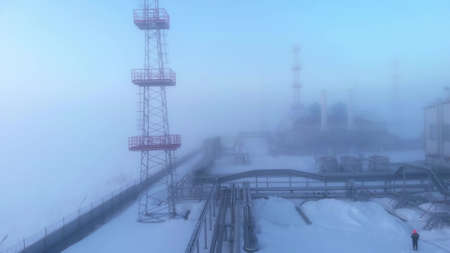 Drone flying over a pipeline in fog due to low air temperature. Oil and gas production in the northern regions, in permafrost conditions. Oil and gas industry in Russia supply of natural gas to Europeの写真素材