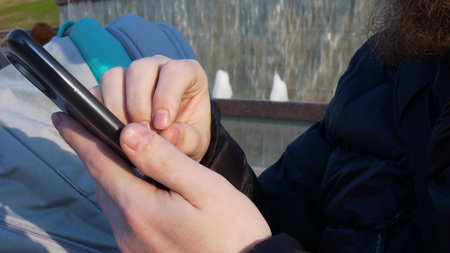 Close-up of the fingers of the hands drive on the smartphone screen, enter a text message on the...