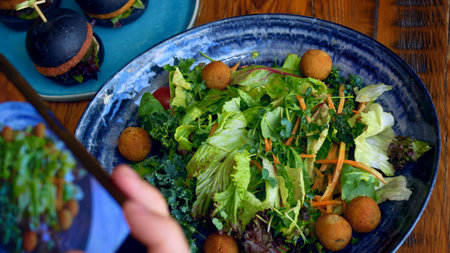 A beautiful green salad in a plate with meat balls, a healthy and balanced nutrition for diet and...