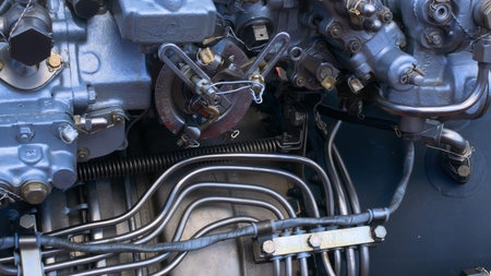 Stainless steel piping to supply fuel and lubricant to the engine. Engine close-up with tubes and...