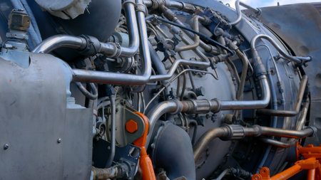 Mechanic engine expert shows the design of a helicopter engine, the mechanical parts of a high-tech...