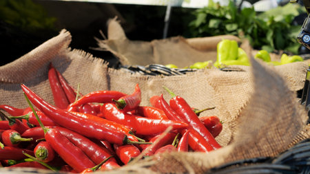 Chili peppers on counter of a farm shop that are grown with love and care for people. The hottest...
