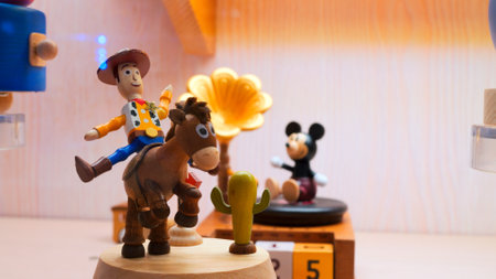 Wooden man on horse is spinning in showcase. Cinematic video: showcase with spinning wooden man on horse. Close up wooden man on horse spins and waits for buyers in showcase.の写真素材