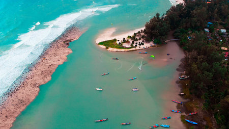 Kitesurfer in laguna on shallow of ocean. Kitesurfing on tropical island with amazing blue water....