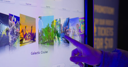 Toronto, Canada - May 6, 2023: Person scrolling through menu gallery of virtual reality simulator. Choose one of different locations and simulations for VR goggles to experience new emotions.のeditorial素材