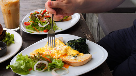Man enjoying healthy full nutrition in restaurant. Close-up menu of full nutrition in restaurant...
