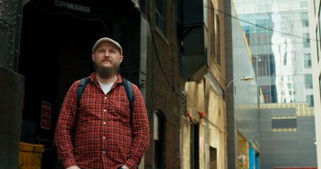 Man embarks on journey of urban migration, conquering bustling metropolis of United States. pursuit...
