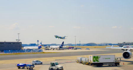 Frankfurt, Germany - May 2, 2023: plane takes off at Frankfurt city airport on runway. Beautiful view of riding cars at Frankfurt city airport not far from plane. Concept use airport in Germany at dayのeditorial素材