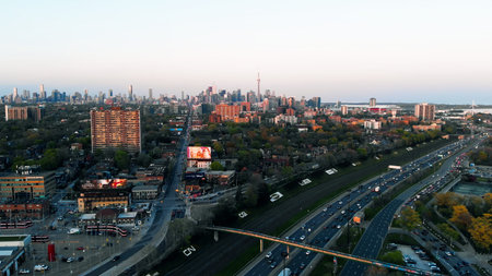 Toronto, Canada - May 6, 2023: drone view of spring city with skyscrapers and densely planted green...