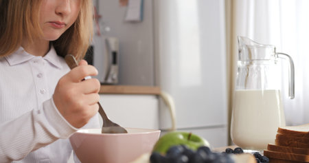 Starting day teenagers tasty breakfast In safe home environment teenagers breakfast epitomizes nurturing upbringing. Teenager are ready for school Concept of healthy tasty breakfast.の写真素材